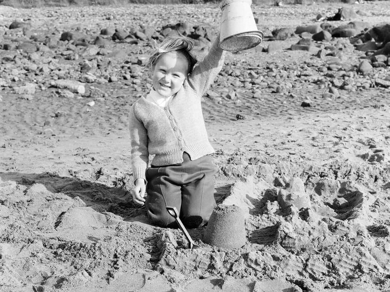A little girl shows off her sand castle on Portobello beach in July 1965.