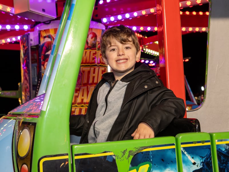 Eddie, 6, enjoying the rides at HMS Sultan Bonfire Night 2025.