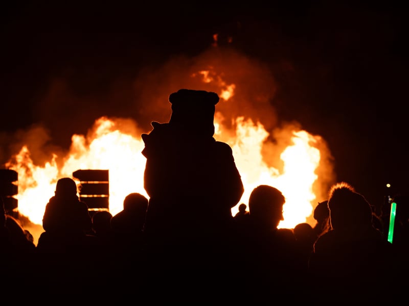A child watches the spectacular bonfire at HMS Sultan on Thursday, October 30.
