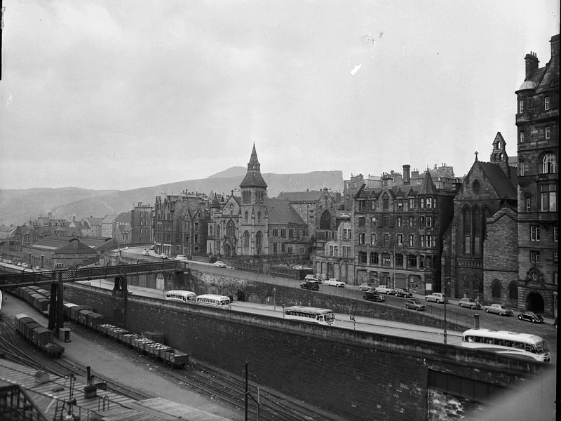 A view of buses travelling up Market Street in June 1960.