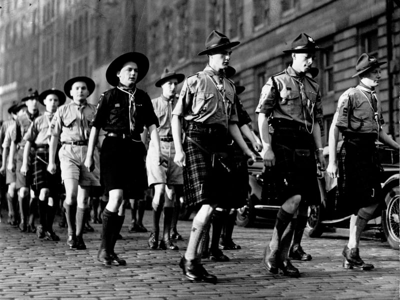 King's Scouts on parade in kilts and hats marching up the Royal Mile to the City Chambers in January 1952.