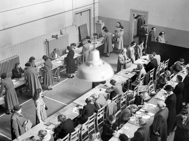 Ration Book distribution inside a hall in the Grassmarket in April 1953. The queue for ration books stretched almost to Candlemaker Row.