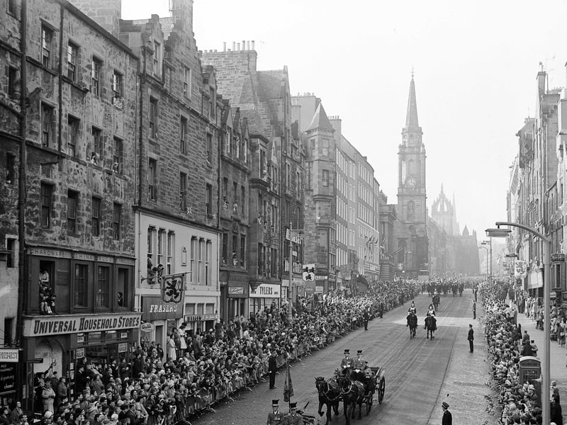 Queen Elizabeth II and King Olav of Norway in the Royal coach as the procession makes its way down the High Street Edinburgh during the King's state visit to Scotland in October 1962.