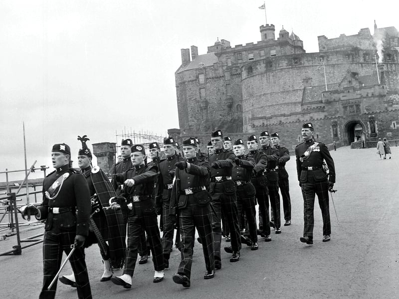 Queens Guard from the 1st Battalion of the Cameronians march down the Royal Mile in 1961.