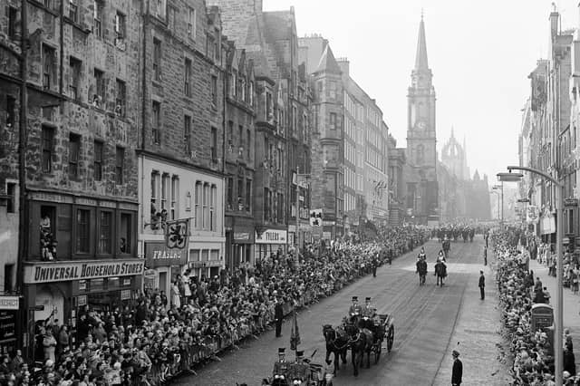 Queen Elizabeth II and King Olav of Norway in the Royal coach as the procession makes its way down the High Street Edinburgh during the King's state visit to Scotland in October 1962.