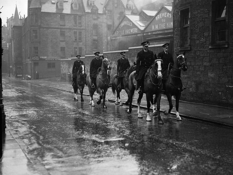 Mounted police out for morning exercise passing by Campbell's Argyle Brewery in the Cowgate in January 1954.