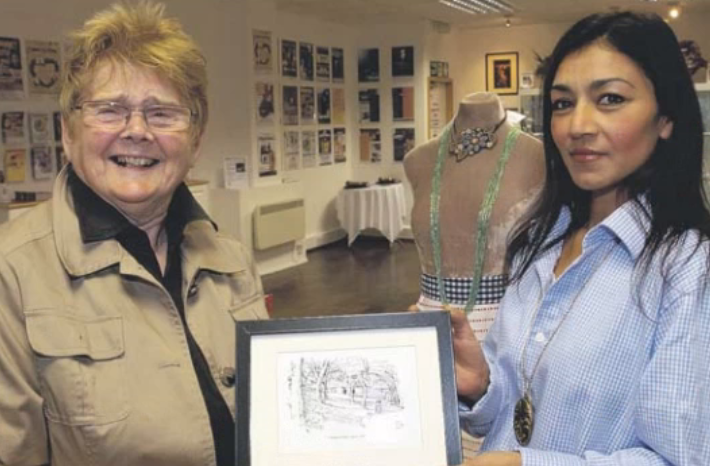 Here is Sheila in 2010 when she supported the new town centre shop of the Customs House.
She is pictured with the Customs House visual arts officer Esen Kaya.
