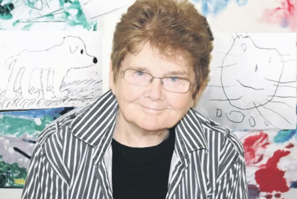 Sheila Graber against a background of children’s artwork at her home in Ireland where she lived from 2004.