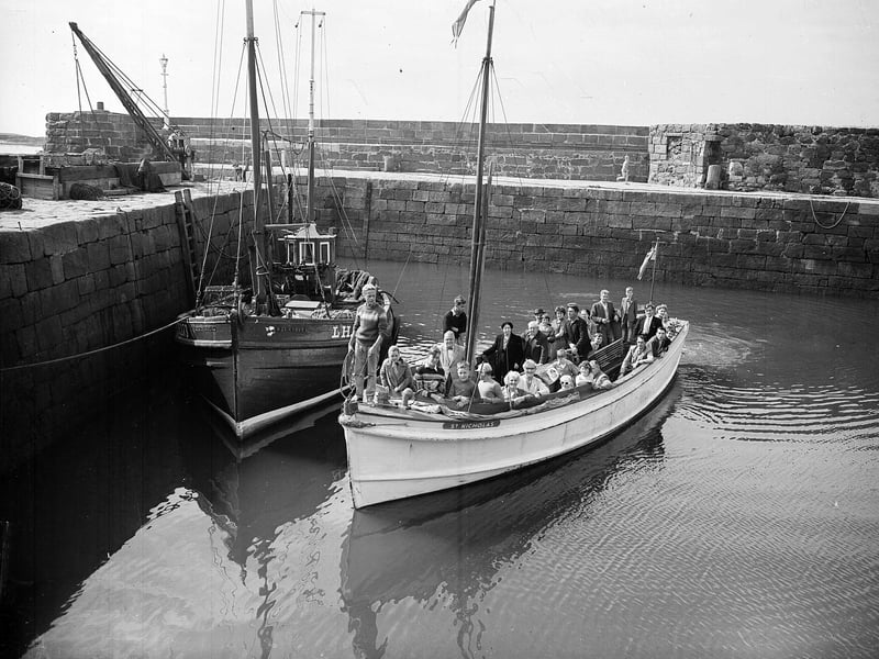 Holidaymakers in a boat in North Berwick Harbout in May 1962.