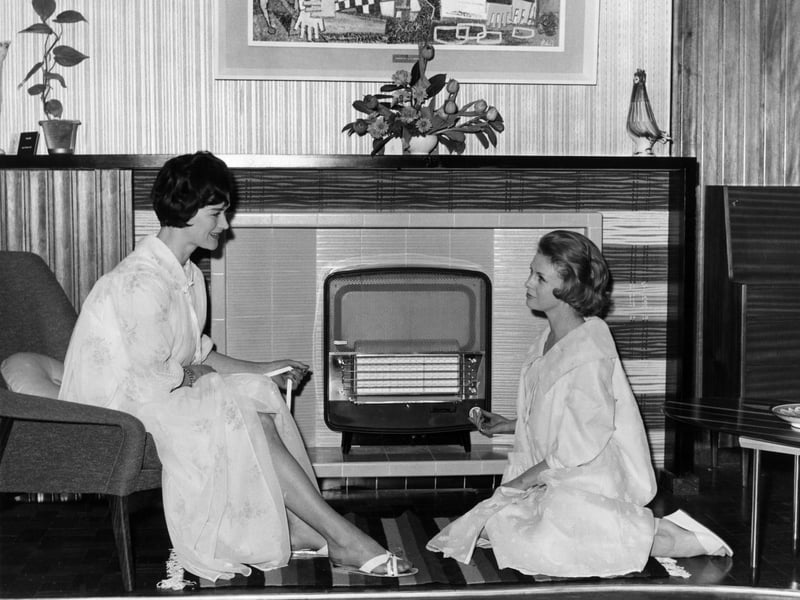 Susan Hook and Ann Grierson with one of the latest gas heaters at an exhibition at London's Royal Horticultural Hall in February 1961