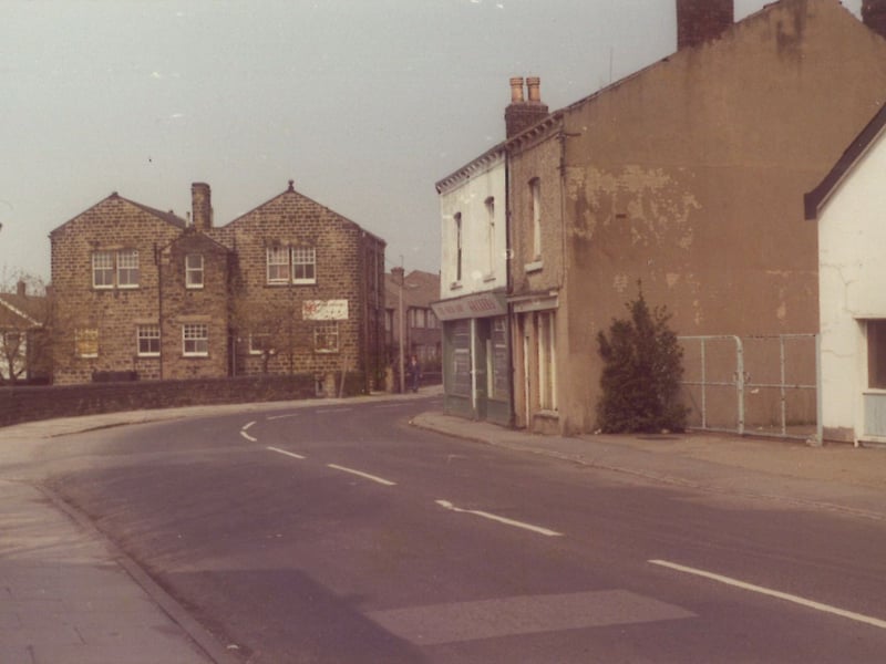 Main Street looking north circa 1970. The green shop on the left was a newsagents, the white building to the extreme right was the former New Empire Cinema.