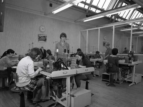 A photograph of Miss Butterworth supervising a group of young machinists. This image from 1970 was taken for a training brochure.