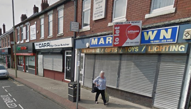 The Pride of India Spice Station is next door to Carr's Butcher and a building 'To Let' in May 2016.