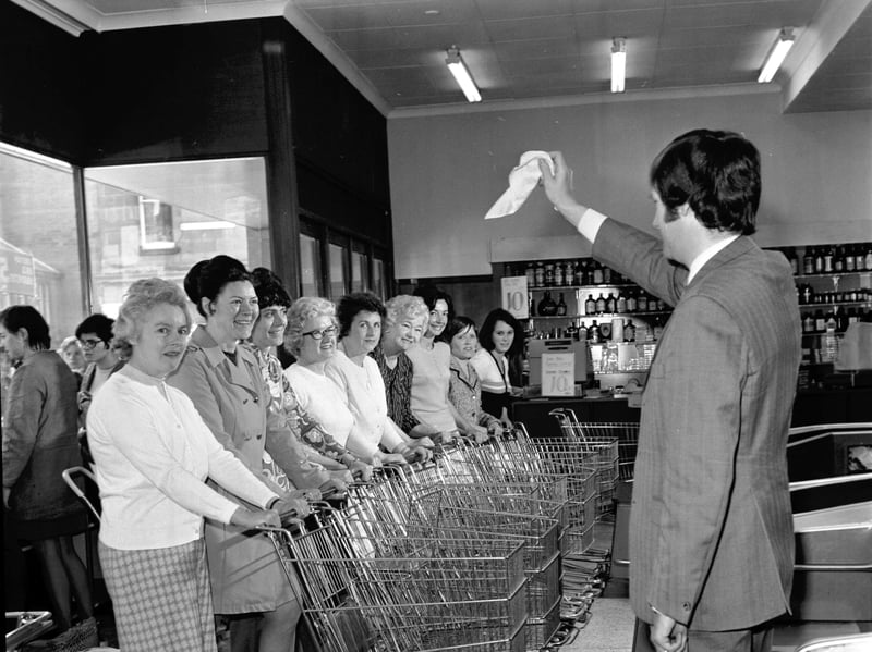 Women with their shopping trolleys line up for a trolley dash at St Cuthberts Co-op in Morningside, Edinburgh, in June 1972