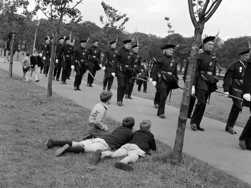 The Royal Company of Archers walk down Jawbone Walk to take part in a shot in the East Meadows in July 1962.