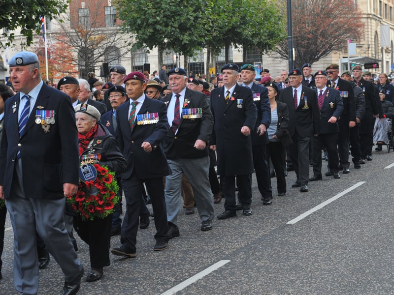 The veterans march to Victoria Gardens.