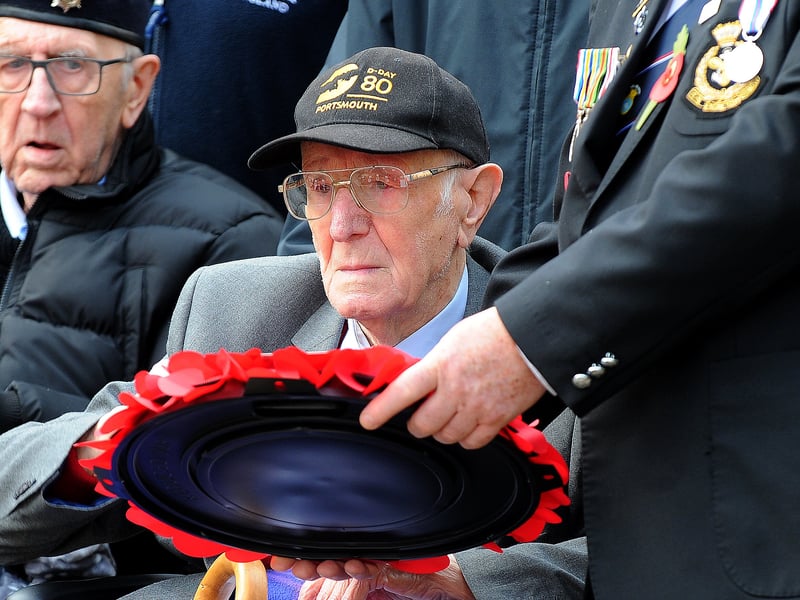 D Day veteran 102-year-old Jack Mortimer, of Seacroft, has a moment of reflection for fallen friends as he lays his wreath .