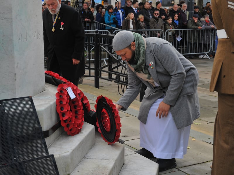 Coun Mothin Ali, of Gipton and Harehills, lays a wreath.