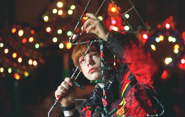 Teenager Russell Ransome who was among some 30 villagers who were making their own Christmas lights as the village was short of funds to buy them.
