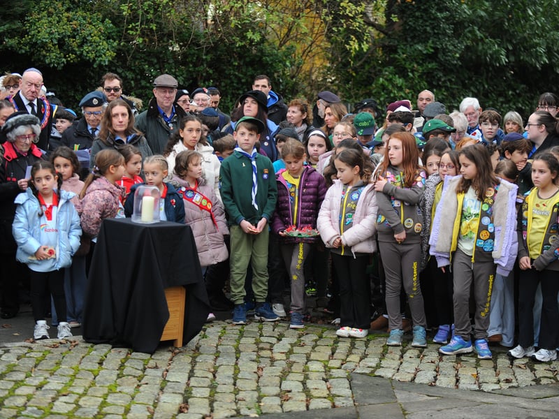 Local children at service, showcasing the importance of teaching the younger generation about the past.