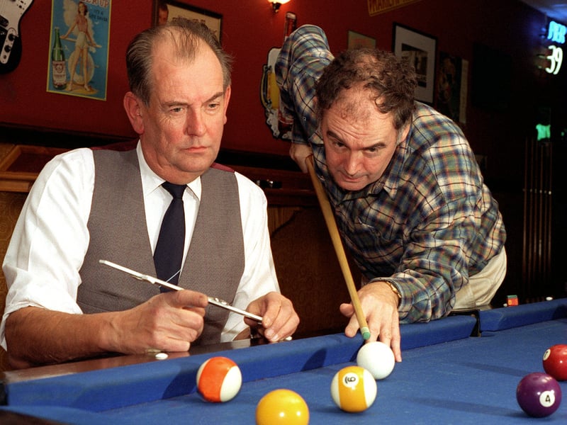 Sky TV darts commentator Sid Waddell, right, henceforth to be known as Fast Siddy, practices American pool at LA Bowl so he will be able to commentate of the sport. Assisting him with the technicalities and angles is ex-maths teacher The Professor, alias Jon Greenwood.