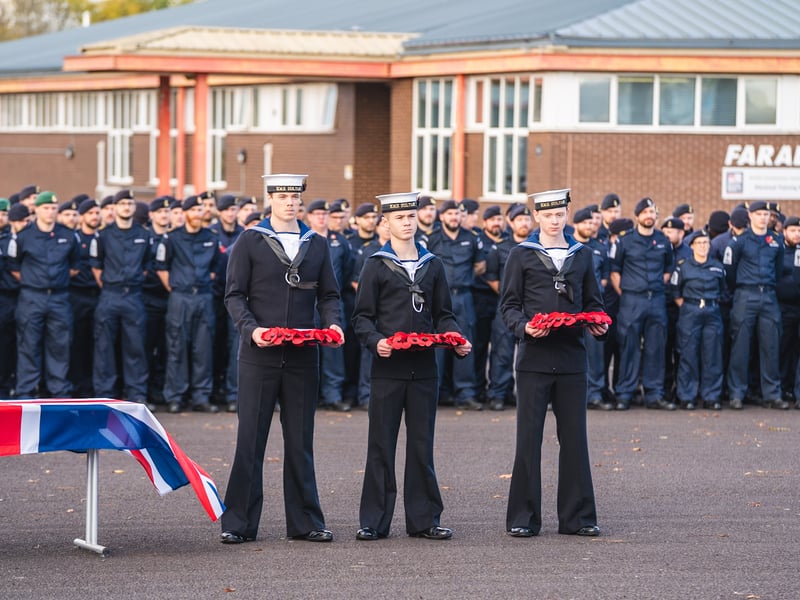 Trainees at HMS Sultan act as wreath bearers during the Drumhead Ceremony. 