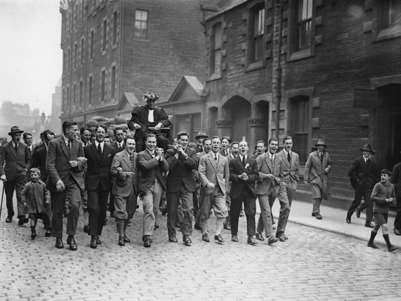 Eric Liddell is carried round the streets after his record-breaking victory at the 1924 Paris Olympics, an achievement celebrated in the 1981 film Chariots of Fire