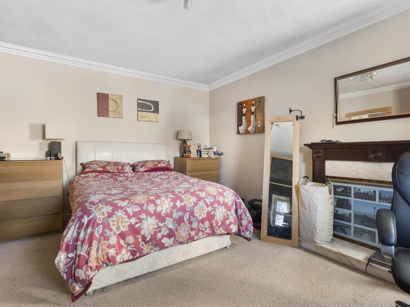 One of the bedrooms enjoys a Juliet balcony overlooking the surrounding area.