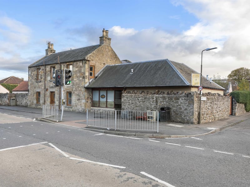 This spacious five-bedroom detached home with attached shop and garden, is situated in the heart of Haddington. The shop is pictured on the corner next to the main detached propery.