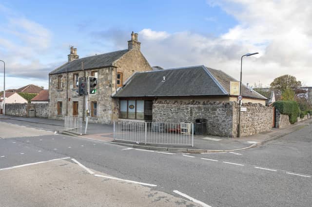 This spacious five-bedroom detached home with attached shop and garden, is situated in the heart of Haddington. The shop is pictured on the corner next to the main detached propery.