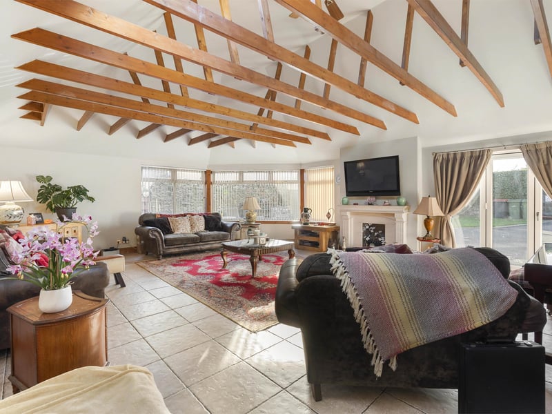 The ground floor accommodation comprises a spacious entrance hall leading to a superbly proportioned sitting room, with exposed beams and generous glazing providing a wealth of natural light.