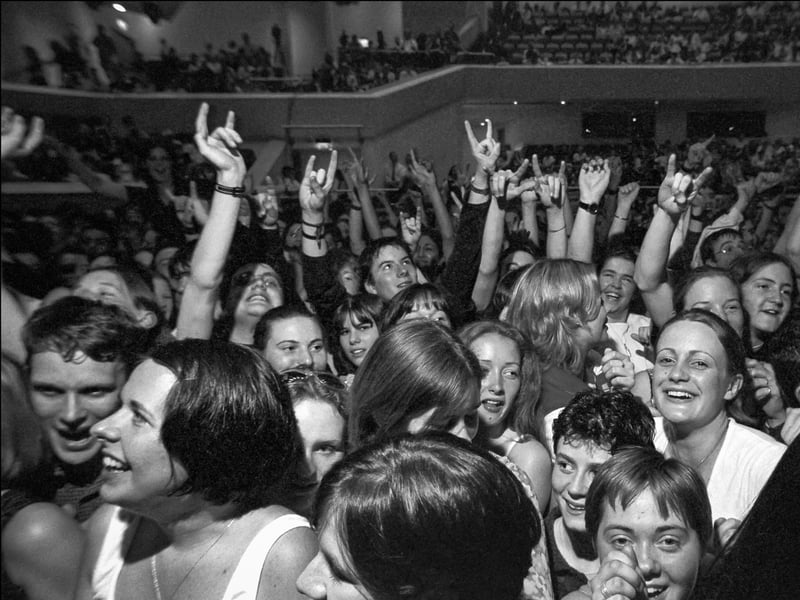 Young revellers dance to the music of U2 at a special concert in support of the Good Friday Referendum in May 1998