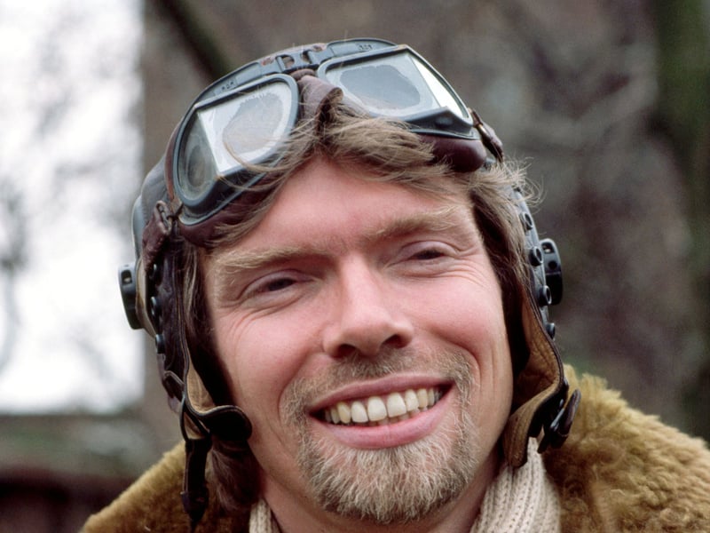 Richard Branson, co-founder of Virgin Atlantic Airways, poses in leather flying jacket and helmet during a news conference to launch the airline in April 1984