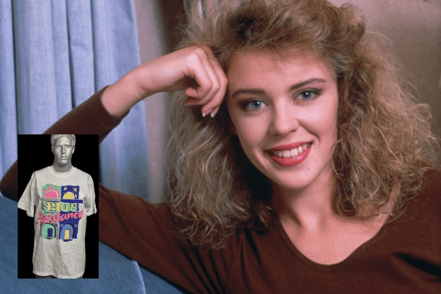 This one-of-a-kind, oversized (XL) T-shirt was used to promote the 1988 Terrence Higgins Trust charity event, Shop Assistance. It features the prized signature of Kylie Minogue and serves as an impromptu backstage autograph book. The back is covered with an eclectic mix of names, including Jimmy Sommerville, Doctor Who's Sylvester McCoy and Sophie Aldred, Blockbusters' host Bob Holness, and news correspondent Kate Adie. A unique piece of 80s celebrity convergence for a great cause.