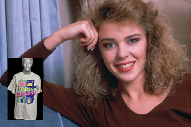 This one-of-a-kind, oversized (XL) T-shirt was used to promote the 1988 Terrence Higgins Trust charity event, Shop Assistance. It features the prized signature of Kylie Minogue and serves as an impromptu backstage autograph book. The back is covered with an eclectic mix of names, including Jimmy Sommerville, Doctor Who's Sylvester McCoy and Sophie Aldred, Blockbusters' host Bob Holness, and news correspondent Kate Adie. A unique piece of 80s celebrity convergence for a great cause.