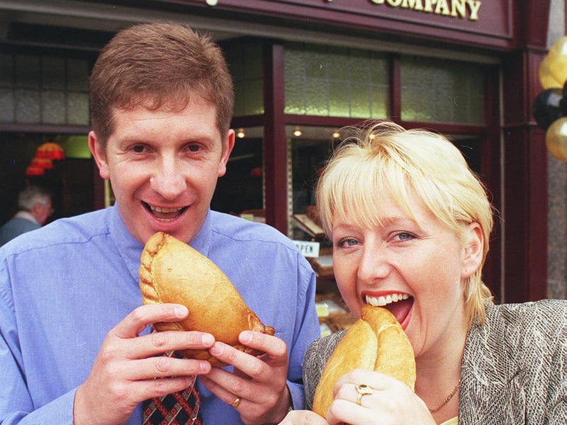 Owners John Worrall and Alexandra Gardner tuck into pasties outside the Proper Pasty Company, on Pinstone Street, Sheffield, in 1999
