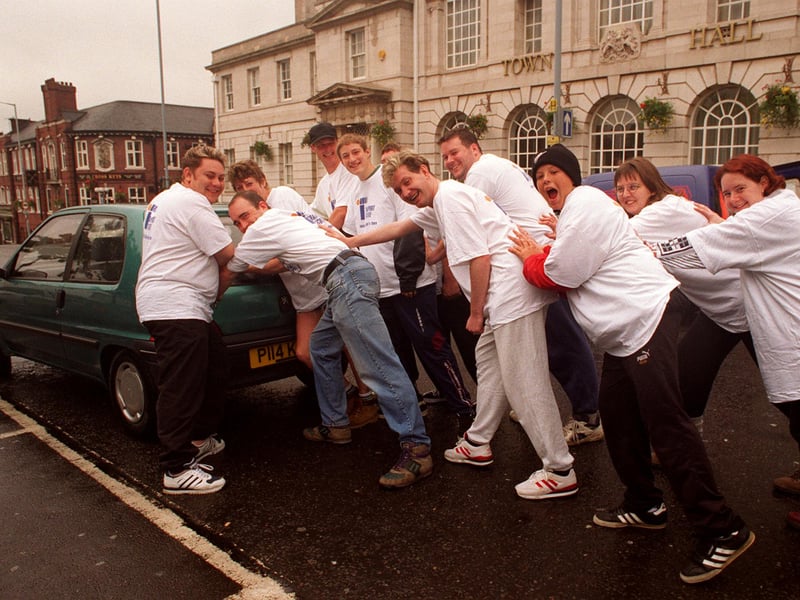 Locals from the Domino pub, on Egerton Street, Sheffield, start their car push in aid of the Jack Hukin-Scatchard Appeal, from Rotherham Town Hall, in June 1997
