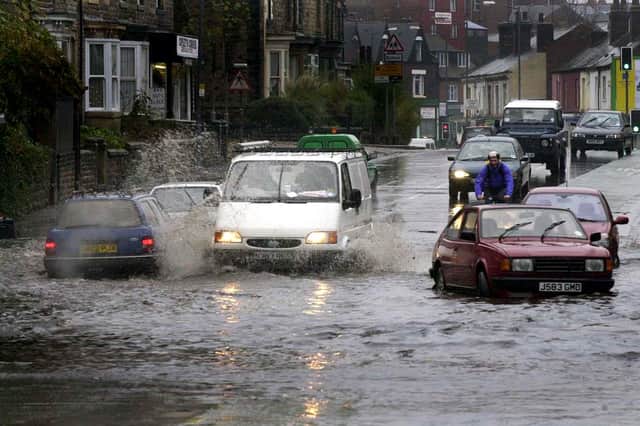 Parts of Sheffield have been placed on flood alert. Photo shows flooding on Abbeydale Road, near the River Sheaf, in November 2002. Photo: Sheffield Newspapers