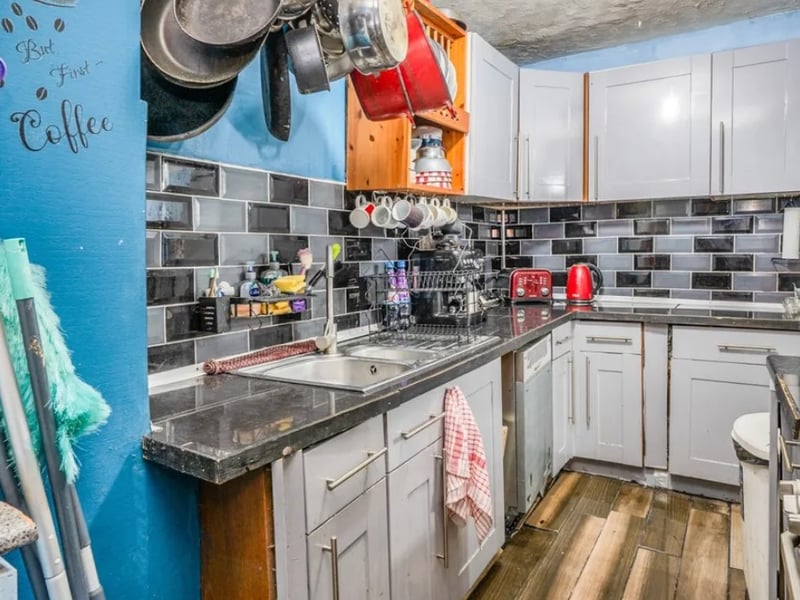 This home comes with three bedrooms, two reception rooms and a bathroom. 