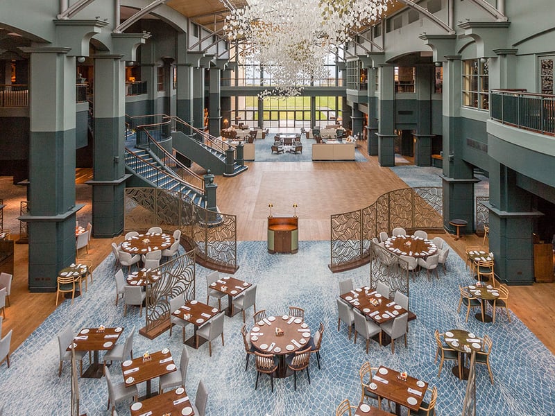 The Squire restaurant sits within the vast and bright atrium at Fairmont St Andrews with views of the Scottish coastline.