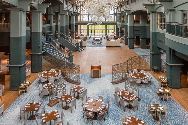 The Squire restaurant sits within the vast and bright atrium at Fairmont St Andrews with views of the Scottish coastline.