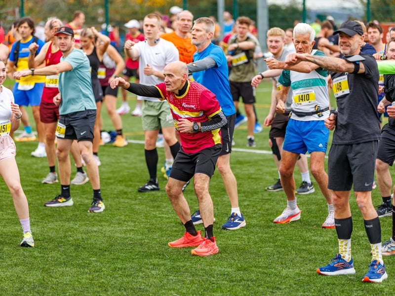 Runners get stuck into the warm up.