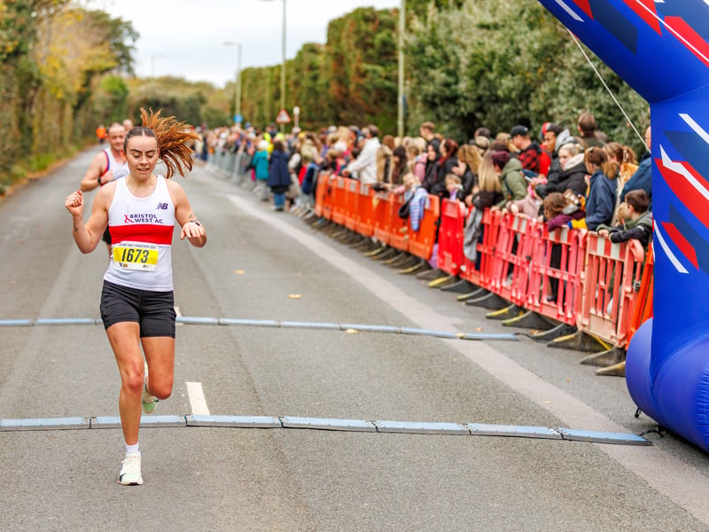 Runners cross the finish line of the Gosport Half Marathon 2025