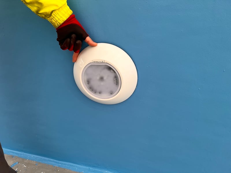The team will start fitting all the lights. The electricians will need to put all the wiring on and then they can hook it all up.
Pictured: This light isn't secure yet, but the site manager is holding it in place to give you an idea of what the finished product will look like.