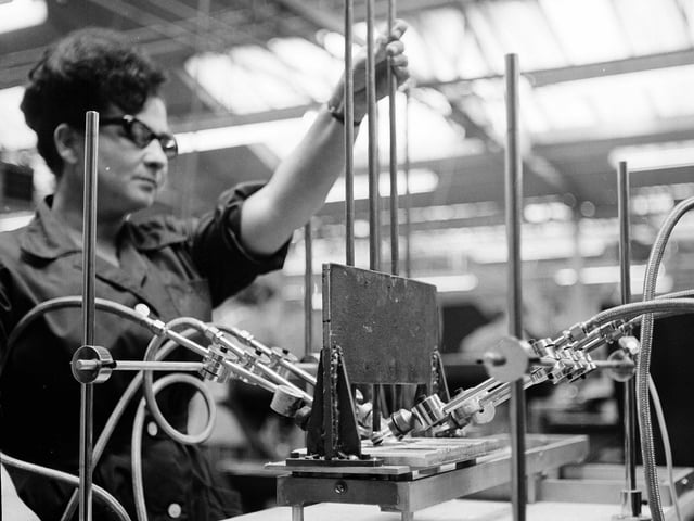 An automatic brazing machine fixing knobs to tractor throttle control rods at the Lennox and Smith factory at Dundee in July 1965.