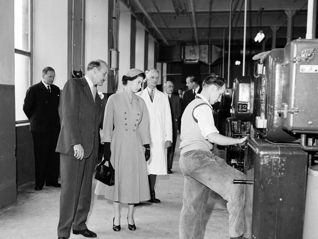Queen Elizabeth II at a jute factory during a state visit to Dundee in June 1955.