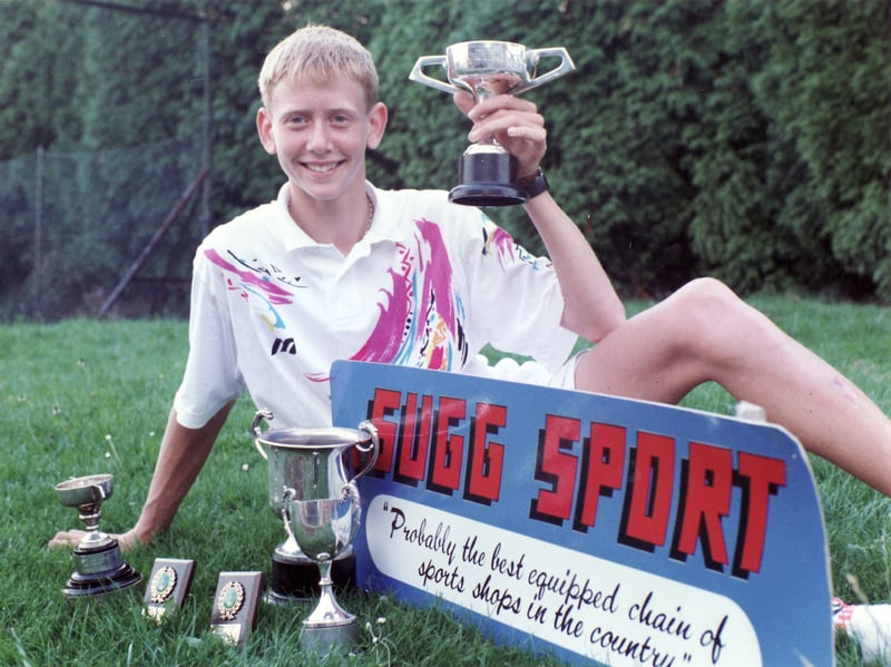 Tennis player David Sherwood pictured in August 193 with some of his trophies and an advert for Sugg Sport, described as 'probably the best equipped chain of sports shops in the country'.