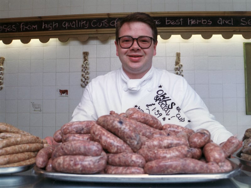 David Harrison, owner of Harri's sausage shop, on Ecclesall Road, Sheffield, in April 1993, with his Owls Special, created for cup final day