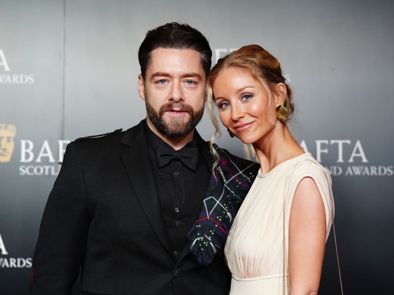Outlander's Richard Rankin and his wife Sammie Russell attend the BAFTA Scotland Awards 2025