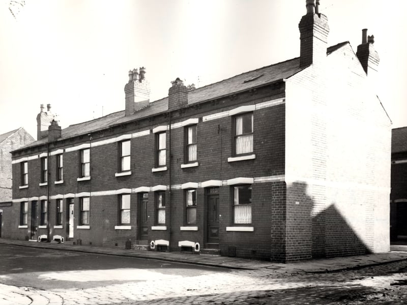 This view looks from Nineveh Avenue onto a row of four back-to-back houses on Meynell Street, numbers run from 44 to 38 left to right. Pictured in November 1966.